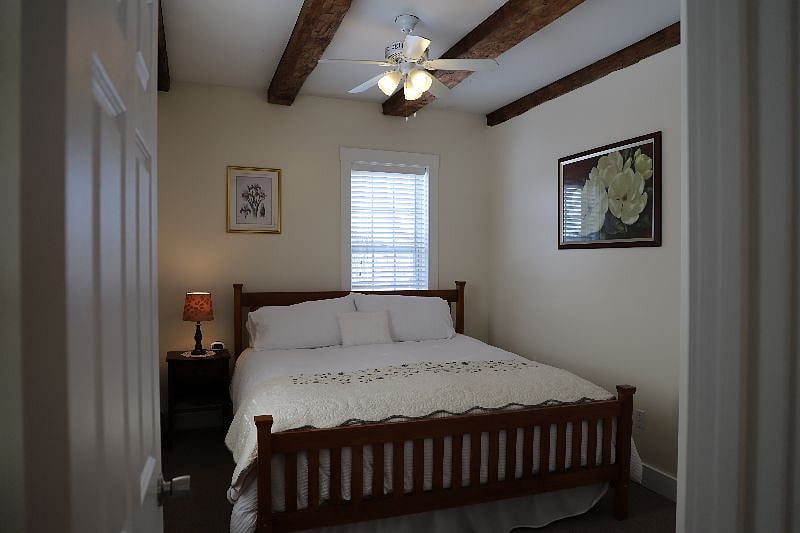 Unit C Bedroom with king size bed and window