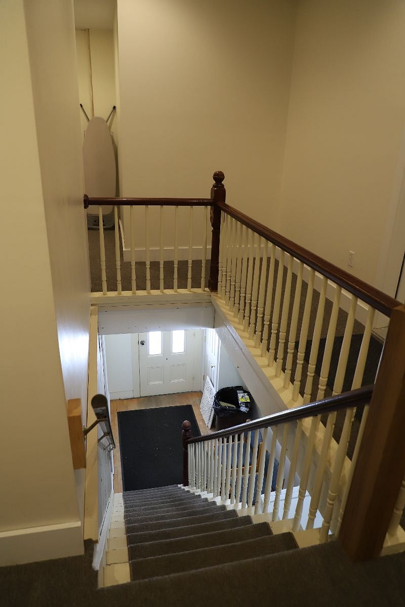 Unit C view from the upper landing to the entrance.