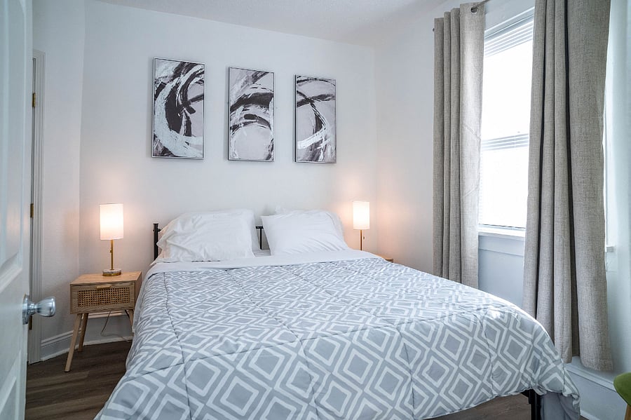 Bedroom 1 with Queen size bed, Zinus Mattress. Dark curtains.
