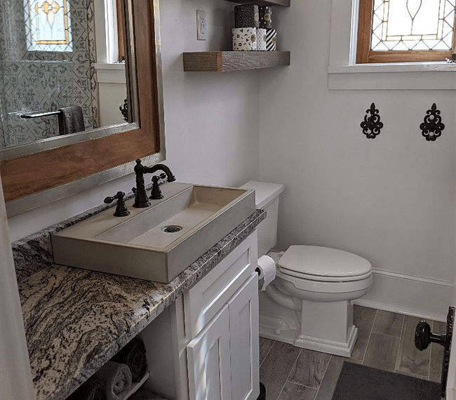 Small, but functional, bathroom makes it hard to get a photo of the beautifully tiled and glass enclosed shower to the right.