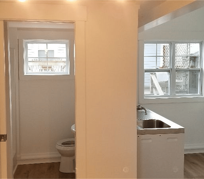 view from LR towards full bathroom & kitchen