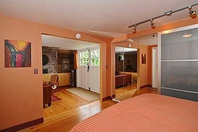 Bedroom Alcove, with queen bed/bedding. LOADS of closet/storage space