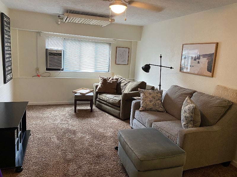 Living room of larger one bed unit - does not show large flatscreen tv provided.