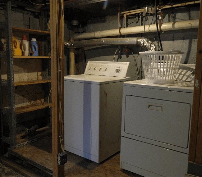 Laundry room in basement. Basement use is strictly limited to the laundry area only. It is not available to unauthorized use.