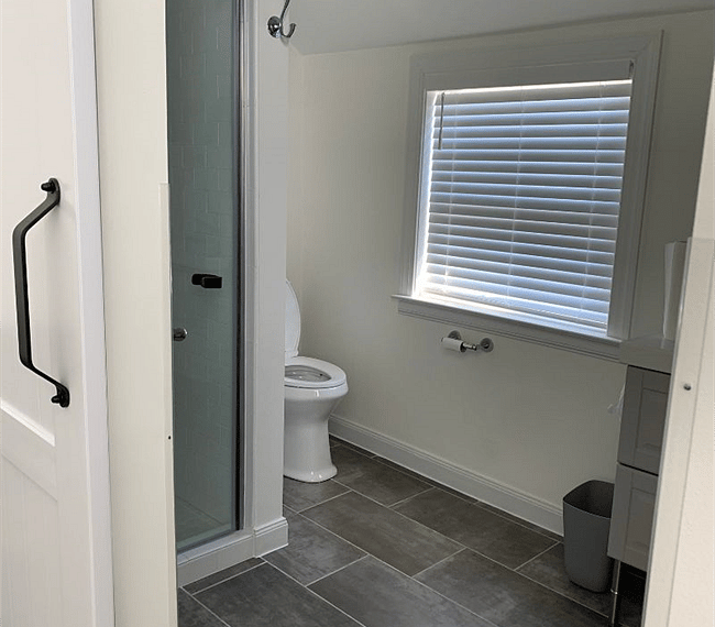 The bathroom is modern and stylish with shower, toilet and vanity
