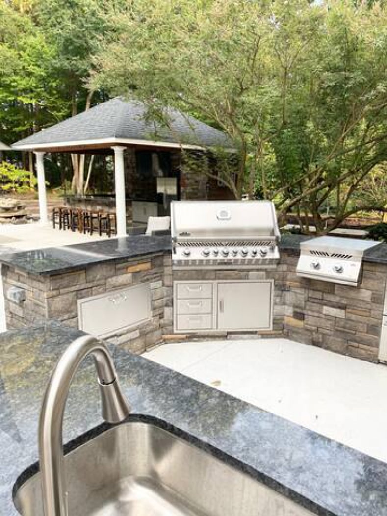 Grill outside and watch tv in our outdoor kitchen