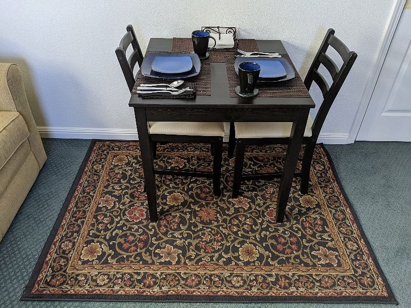 Cafe Table with a full array of dishware and beverage containers.