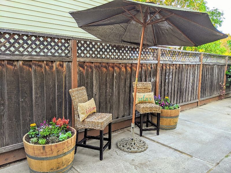 From your designated parking spot, enter through the side gate to the pathway leading to your apartment.