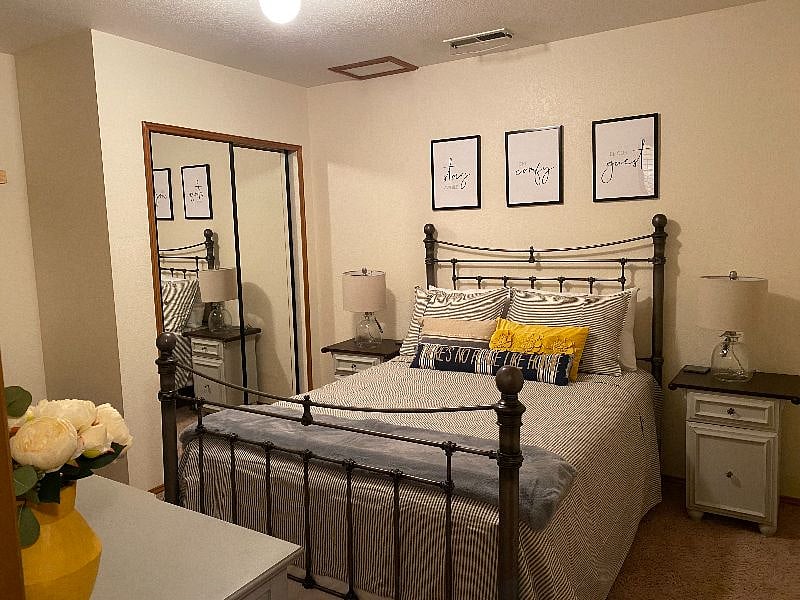 Beautiful 2nd Bedroom off set with Contracting Gray and Yellow Decore.