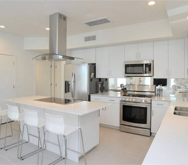 Fully equipped kitchen. Many small appliances are tucked inside the cabinets.