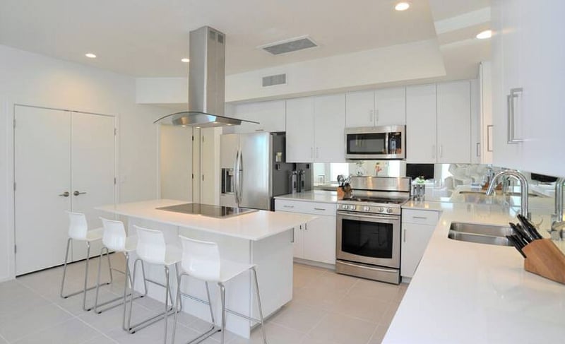 Fully equipped kitchen. Many small appliances are tucked inside the cabinets.