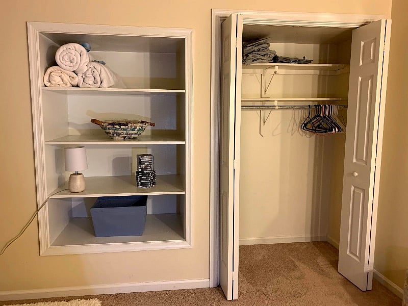 Built in shelves and closet in bedroom