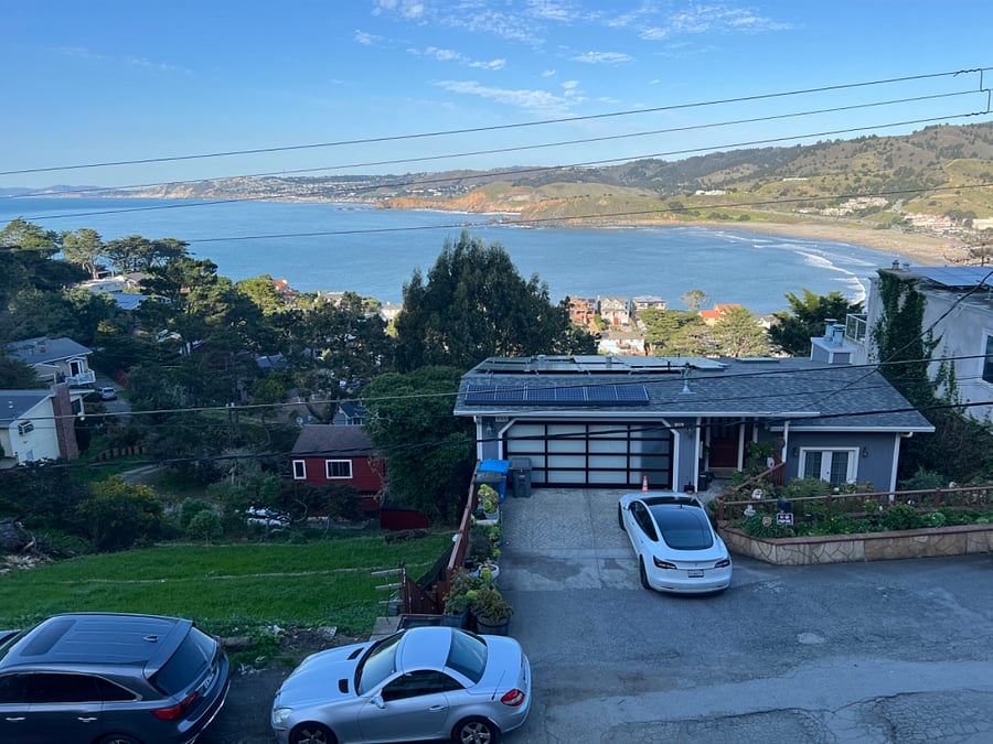 The parking in front of the garage is for the 5 bedroom property. Street parking always available