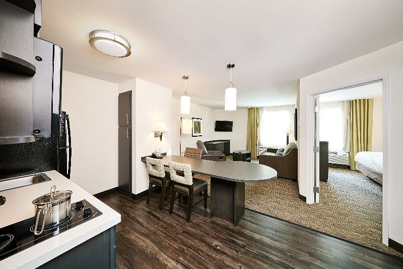 One bedroom suite with separate bedroom with queen sized bed, living room area with pull out sofa bed, recliner and full kitchen. Room has 2 closets.