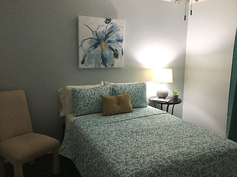 Bedroom w/full bed uses the hall bathroom....comes with chester of drawer, TV, and spacious closet.