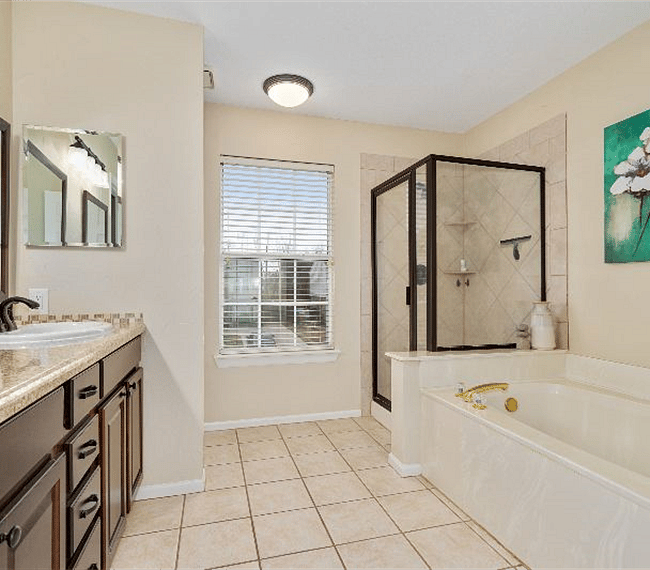 Private master bathroom offers dual vanities, jetted soaking tub and separate walk in shower. In addition enjoy a large walk in closet.