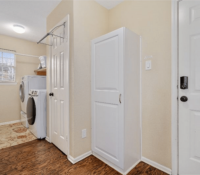 Utility Laundry Room complete with full size washer & dryer & laundry detergent. Additional amenities include iron, ironing board, clothes drying bar and attached 2 car garage.