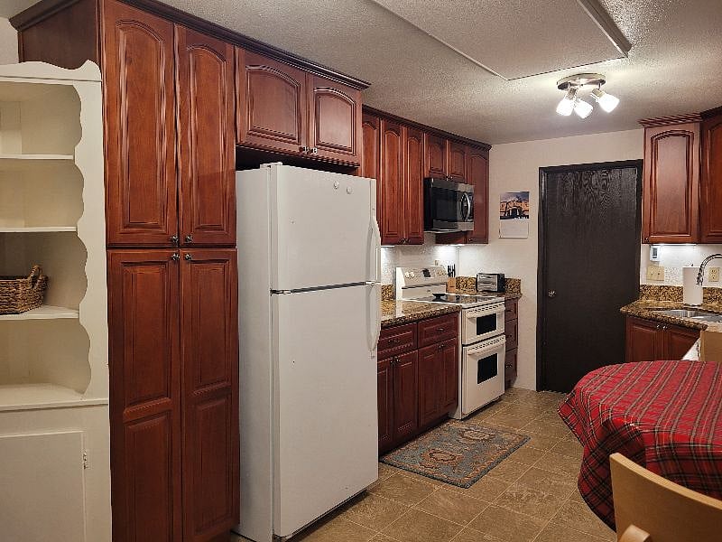 Doorway leads to shared laundry area