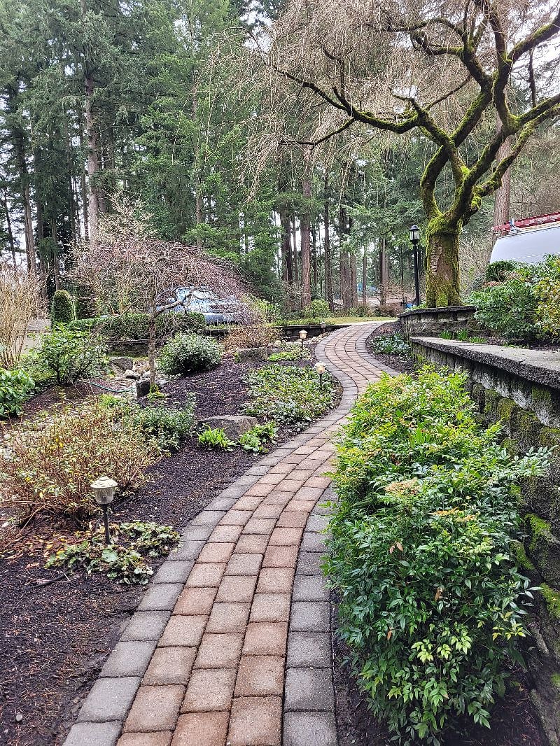View looking up walkway to off street parking area