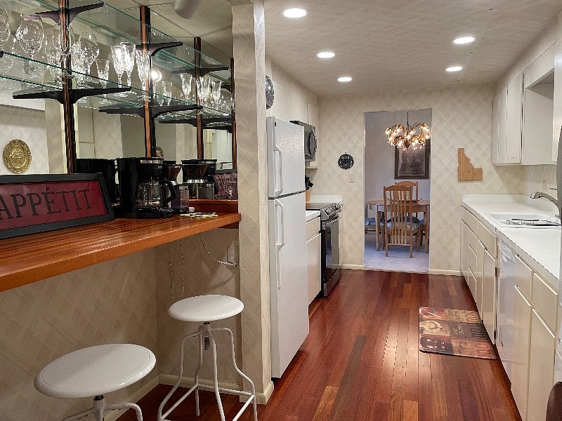 Big kitchen with new appliances including induction range, dishwasher, microwave and washer/dryer
