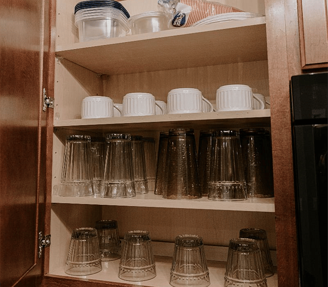 kitchen stocked with dishes/cookware/silverware/cooking utensils