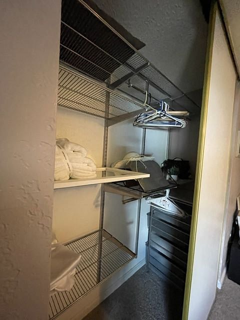 Both of the closets in the master bedroom have shelving and additional drawer storage. Hangers included.