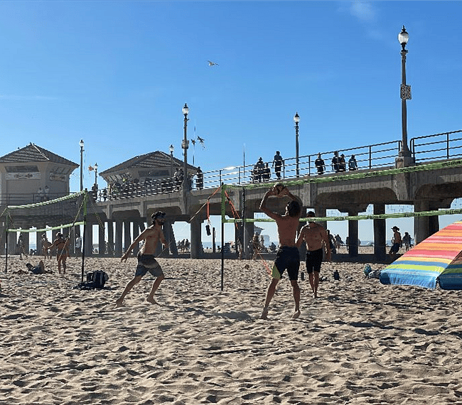 Walk Right down the beach boardwalk and join a volleyball game; restaurants on the beach as well; just wake up and walk on over
