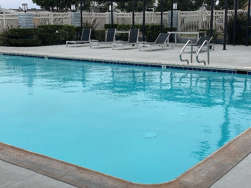 Huge heated swimming pool for swimming laps or hanging out; lots of comfy chaise lounges as well as a huge Jacuzzi and clubhouse with pool tables and more