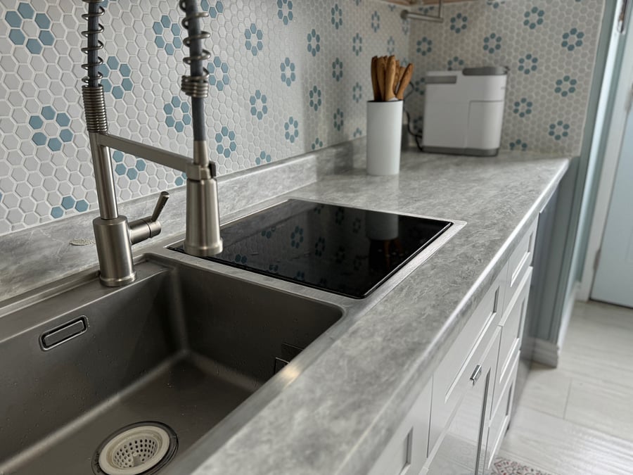 This is a high-end Dishwasher to the right of this full size sink
