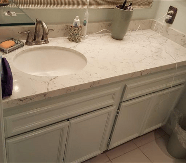 The bathroom is modern and stylish with shower, toilet and vanity