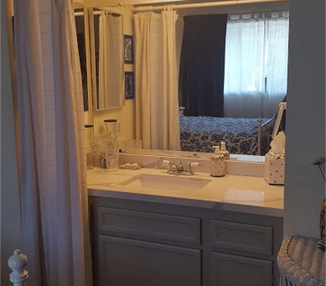 The bathroom is modern and stylish with shower, toilet and vanity
