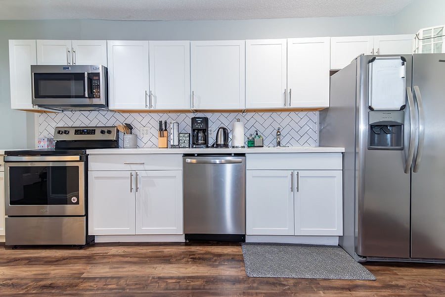 Electronic stove with basic kitchen supplies available. 
