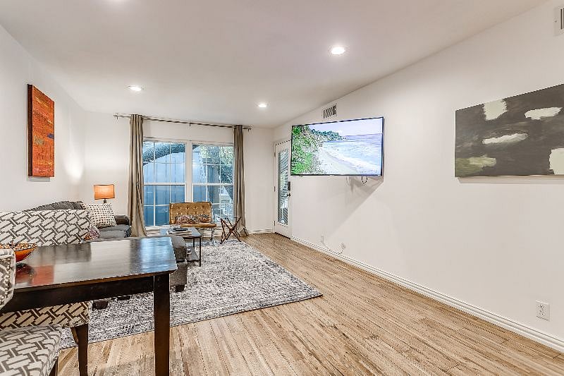 Settle in and watch a movie on the flat screen TV
