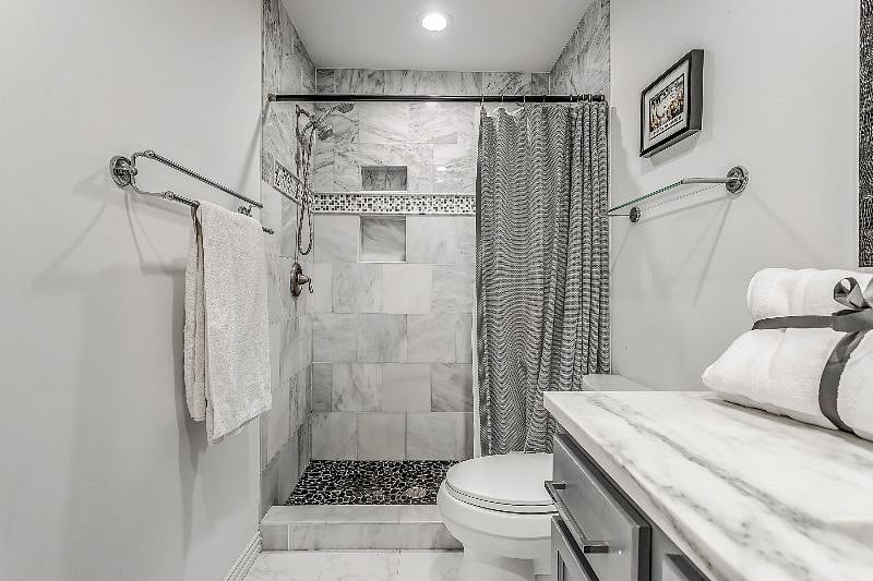 The bathroom is modern and stylish with shower, toilet and vanity
