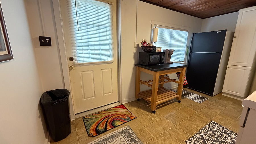Decent sized kitchen
stocked with plates/utensils, pots and pans. Microwave and keurig.