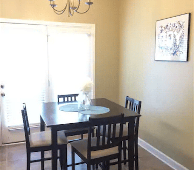 Dinning room with access to fenced in patio.