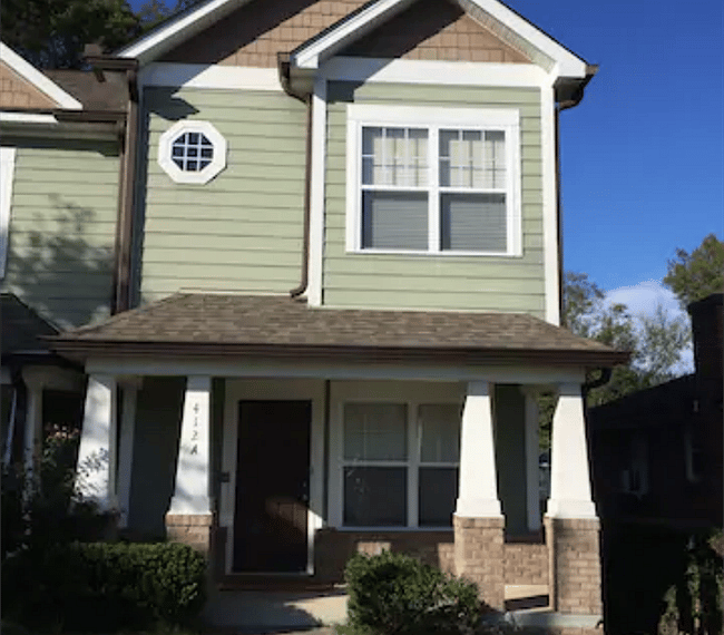 Charming exterior with small front lawn and large back yard with fire pit. Plus a fenced-in private patio.