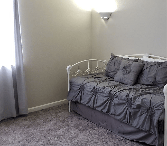 Guest Bedroom (Trundle day bed = two twins or pop-up to mimic King)
Antique Desk in this room. 