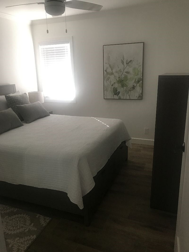 Bedroom with dresser and 2 under bed drawers