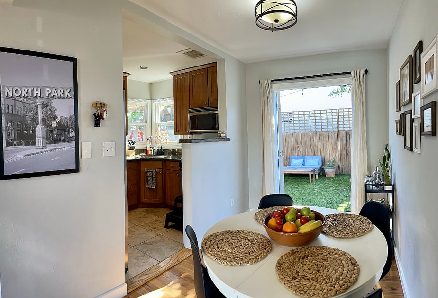Looking out to the backyard and kitchen to the left.