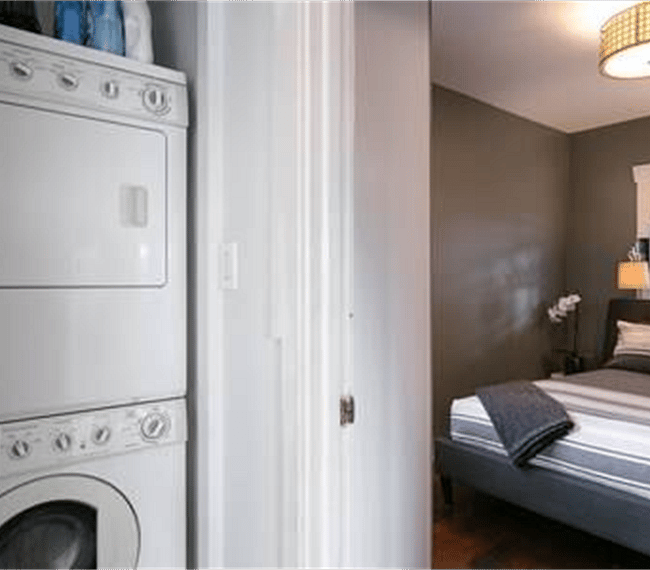 Full-sized stacked washer/dryer.