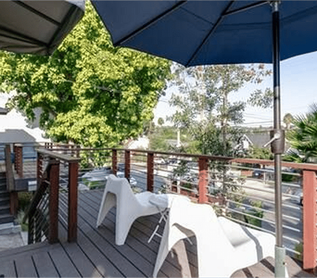 Private front deck on quiet tree-lined street.  Beautiful downtown views, especially at night.