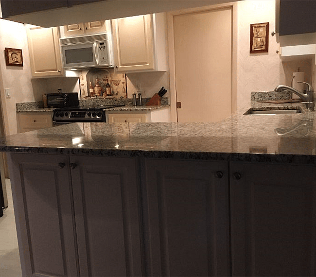 View into kitchen from den.