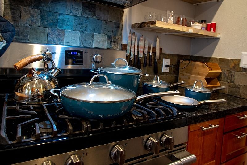 Gas stove with new aluminum cookware is the home chef's dream.