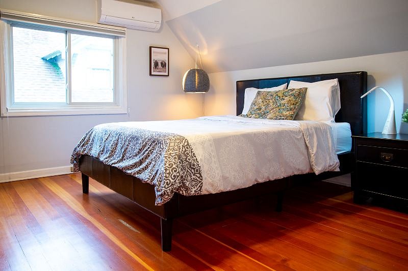 Upstairs bedroom #2 features a queen size bed with lots of space for relaxing.