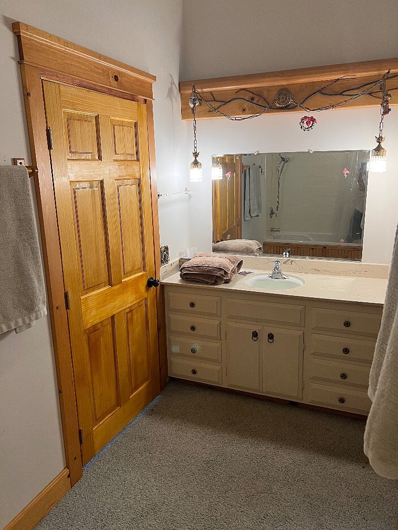 Spacious dressing room with tub and shower