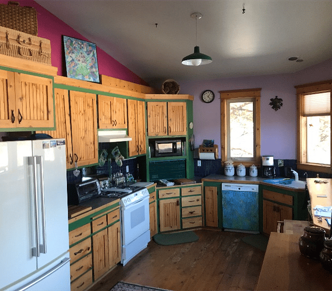 Spacious kitchen with door to deck