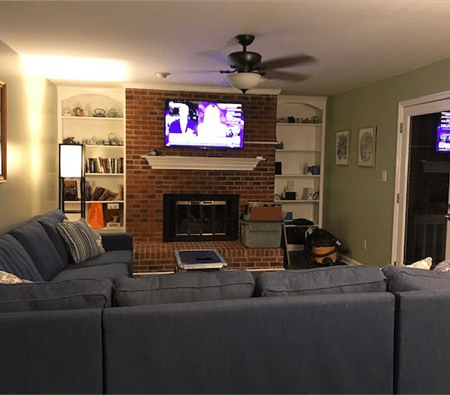 Living area with access to large back deck. Internet TV available. 