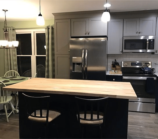 Kitchen with large butcher block island. Separate food pantry area available for tenant. 