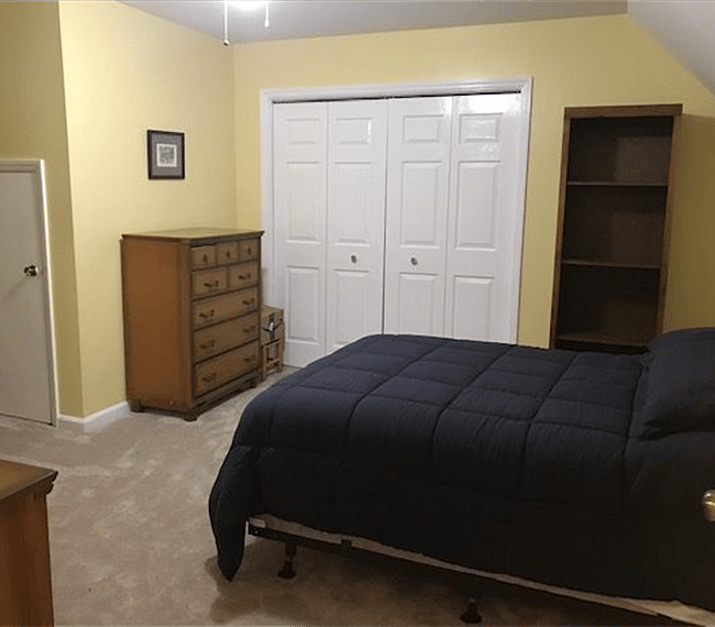 Upstairs bedroom # 1 - full-size bed, 2 dressers, and bookcase